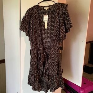 Black dress with orange grey & white dot pattern.